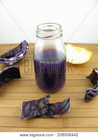 Red cabbage smoothie with apple in a bottle