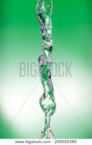 a jet of water on a green background