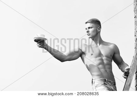 Man Holding Cup Of Coffee On Sky Background, Serious Face
