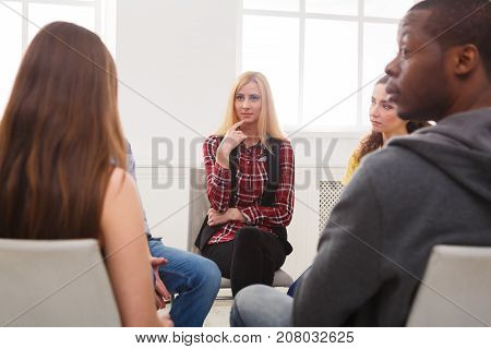 Meeting of support group. Young woman therapist listening to other people. Mental health, psychotherapy concept