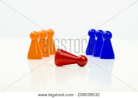 Close-up photo of a group of different-colored pieces in different positions on a white background - applicable to the team view