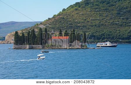 MONTENEGRO, PERAST - AUGUST 13, 2017: Island of Saint George (dead island) is one of the two islets off the coast of Perast in Bay of Kotor until the 19th century the famous captains of Perast were buried on this island
