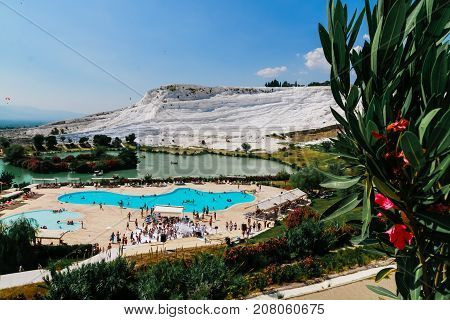 People In Travertine In Pamukkale Cotton Castle Which Is One Of The Unesco World Heritage Site In Tu