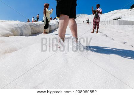 People In Travertine In Pamukkale Cotton Castle Which Is One Of The Unesco World Heritage Site In Tu