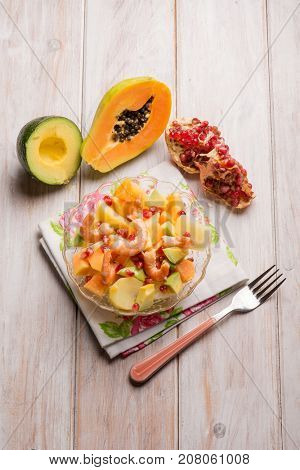 shrimp salad with potatoes avocados papaya and pomegranate