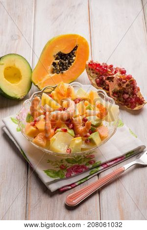shrimp salad with potatoes avocados papaya and pomegranate