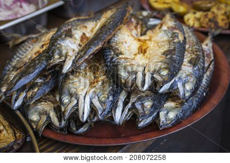 Grilled Fish Mackerel Being Served On Food Stall On Open Kitchen Food Festival