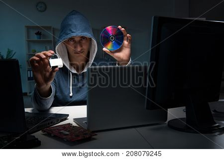 Hacker hacking computer at night