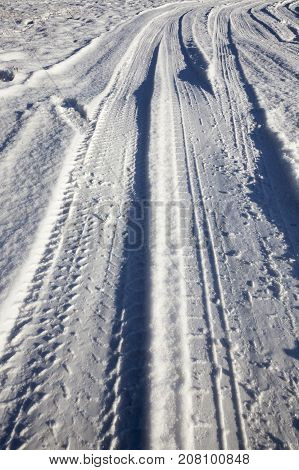 Snow On The Road In The Winter Season. Traces Of The Car And Other Vehicles, Formed A Lot Of Ruts On