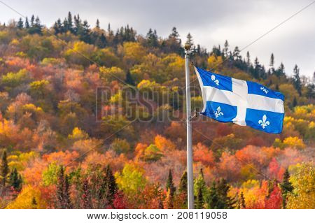 Quebec flag and fall colours in the Eastern Townships in Canada