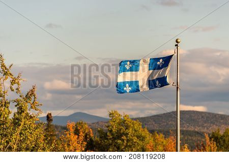 Quebec flag and fall colours in the Eastern Townships in Canada