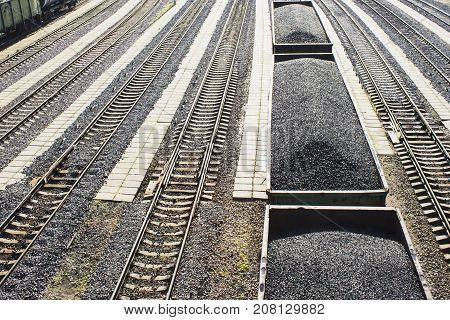 rail cars loaded with coal, a train transports coal. Many different rail cars