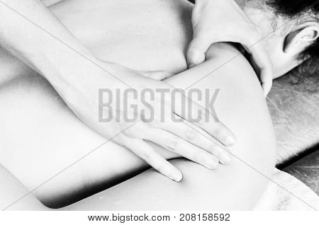 Physiotherapist, Chiropractor Giving A Massage And Stretching Of Subscapularis And Rhomboid To A Pat