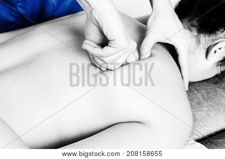 Physiotherapist, Chiropractor Giving A Massage And Stretching Of Subscapularis And Rhomboid To A Pat