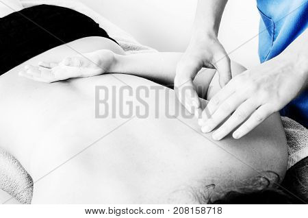 Physiotherapist, Chiropractor Giving A Massage And Stretching Of Subscapularis And Rhomboid To A Pat