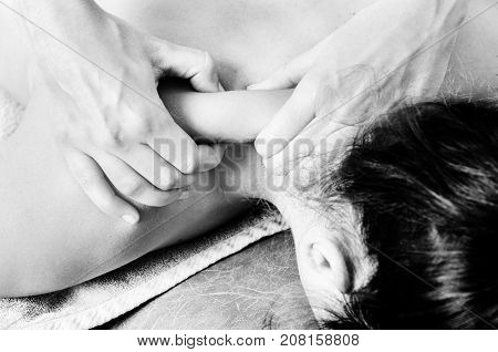 Physiotherapist, Chiropractor Giving A Massage And Stretching Of Subscapularis And Rhomboid To A Pat