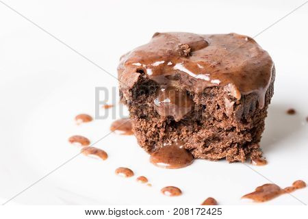 Sliced Chocolate Cup Cake Muffing With Topping Melting Chocolate Cream Above White Marble Background