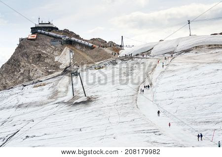 People Hiking Around Dachstein Hunerkogel Mountain Station, Alps, Austria
