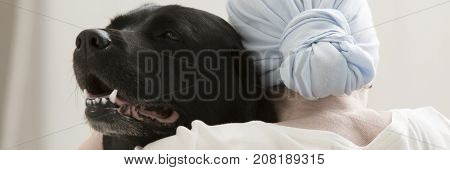 Sick Person Hugging Black Dog
