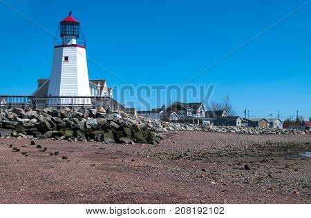Lighthouse in St Andrews at low tide on the Bay of Fundy
