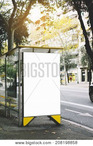 Blank advertising light box on bus stop mockup of empty ad billboard on sun day bus station template banner on background city street for poster or sign in Barcelona afisha board and taxi cars