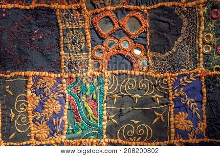 Retro patchwork on old cotton handmade carpet. Patterns on texture of vintage blanket surface with flowers.