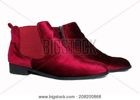 Lady's red ankle boots isolated on white background.