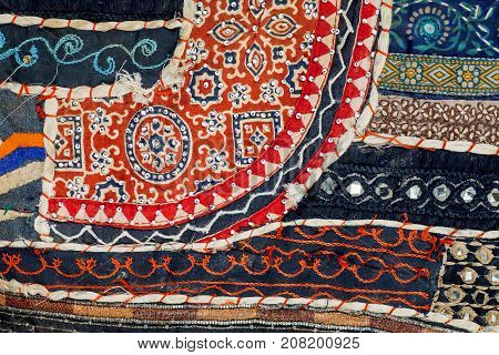 Abstract lines of retro patchwork on old cotton handmade carpet. Patterns on texture of vintage blanket surface with flowers.
