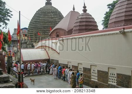 GUWAHATI ASSAM INDIA - JULY 4 2014 : Hindu devotees que at Kamakhya Temple or Kamrup-Kamakhya temple dedicated to the mother goddess Kamakhya. It is famous Hindu religious destination.