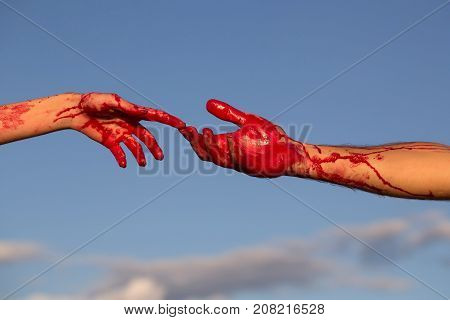 zombie hands male and female of man war soldier and girl or woman with bloody wounds and red blood on skin on blue sky background