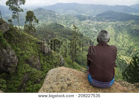Ella, Sri Lanka - April 3 2017: Local Man With Sarong Enjoying The View Into The Valley Of Ella Rock