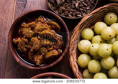 Stock photo of Amla/Avla/Aavla and it's by product called pickle or achar, selective focus