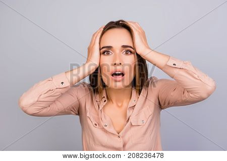 Really?! Cute Shocked Brown Haired Lady Is Amazed With Wide Open Eyes, Mouth, Holding Head, In Forma