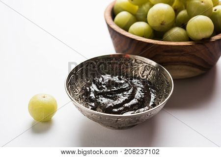 Stock photo of Amla/Avla/Aavla and it's by products like chyawanprash or chyavanprash, selective focus