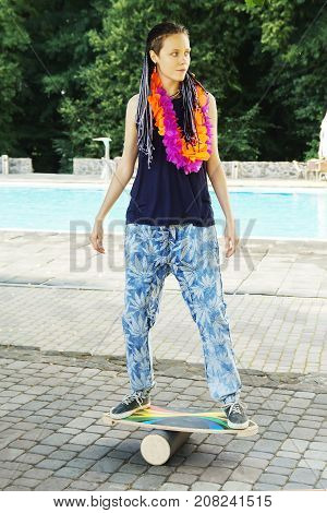 Girl On Oval Wooden Deck For Balance Board. Plastic Roller For Balance Board. Rocker-roller Boards.
