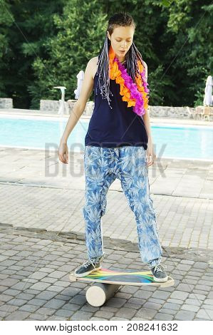 Girl On Oval Wooden Deck For Balance Board. Plastic Roller For Balance Board. Rocker-roller Boards.