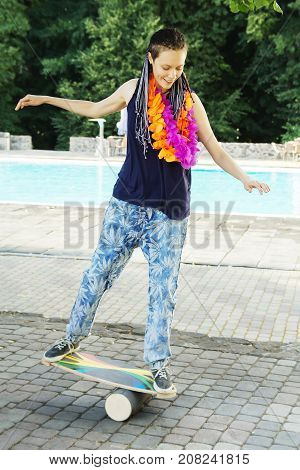Girl On Oval Wooden Deck For Balance Board. Plastic Roller For Balance Board. Rocker-roller Boards.