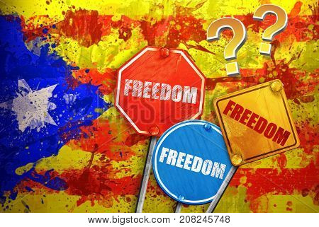 Political slogan in the form of traffic signs with Flag of Catalonia on the background. Signs with word FREEDOM. Independence of catalonia. Referernundum and protests in Catalonia, Barcelona.