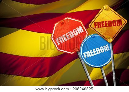Political slogan in the form of traffic signs with Flag of Catalonia on the background. Signs with word FREEDOM. Independence of catalonia. Referernundum and protests in Catalonia, Barcelona.