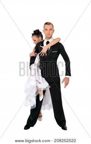dance ballroom couple in a dance pose isolated on white background. sensual professional dancers dancing walz tango slowfox and quickstep. couple in love romantic concept