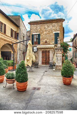 PITIGLIANO, ITALY - JULY 26, 2017: Cafe in the historic center of gorgeous etruscan and medieval town Pitigliano built of tuff stone, Grosseto, Tuscany, Italy. Called 