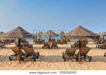 Sunbeds on the Portuguese beach in the summer in Albufeira. Algarve