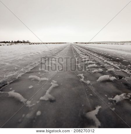 Snow-covered Road In The Winter Season. Close-up Photo