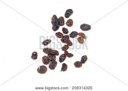 black raisins isolated on white and wooden background