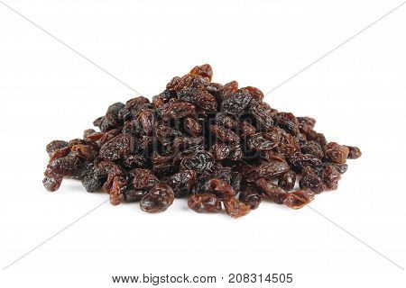 black raisins isolated on white and wooden background