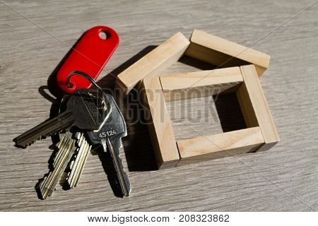 A wooden house concept  with house keys