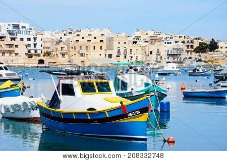 BIRZEBBUGA, MALTA - APRIL 1, 2017 - Traditional Maltese fishing boats in the harbour Birzebbuga Malta Europe, April 1, 2017.