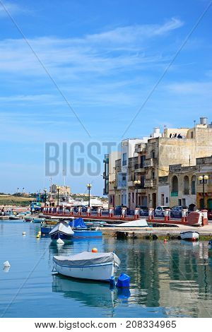 BIRZEBBUGA, MALTA - APRIL 1, 2017 - Traditional Maltese fishing boats in the harbour Birzebbuga Malta Europe, April 1, 2017.