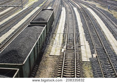 rail cars loaded with coal, a train transports coal. Many different rail cars
