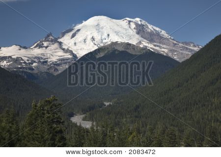 Mount Rainier Looming Over River And Valley
